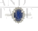 Gold ring with oval sapphire and diamonds