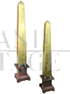 Pair of gilded wooden obelisks with porphyry effect base