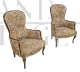 Pair of vintage wooden armchairs covered with floral fabric