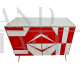 Sideboard with white and red glass geometries