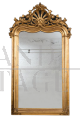 Antique Louis Philippe mirror in gilded and carved wood