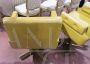 Coppia di poltrone vintage girevoli in skai giallo ocra
