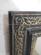 Specchio anni '20 con cornice laccata in nero e oro