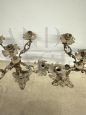 Coppia di candelabri in bronzo del '900 a cinque fiamme con putti