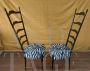 Coppia di sedie Chiavarine in ebano con schienale alto