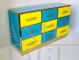 Cassettiera design con 9 cassetti in vetro giallo e azzurro 
