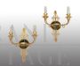 Coppia di applique antiche Impero in bronzo dorato e satinato                            