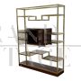 Libreria design in ottone e makassar con vetrina centrale