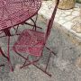 Set da giardino con tavolo e 4 sedie in ferro battuto laccato rosso, anni '70