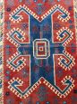 Tappeto turco antico dell'800 in lana rossa con motivi geometrici, 170 x 130cm