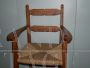 Seggiolone alto vintage con seduta in paglia e braccioli