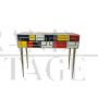 Consolle in vetro colorato e ottone con due cassetti                            