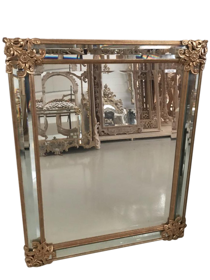 Antique mirror in gilded wood with flowers