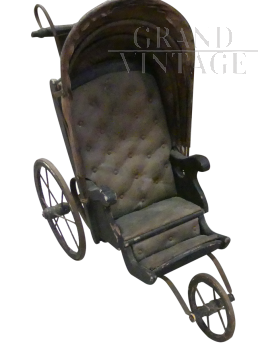 Antique toy stroller pram from the 19th century