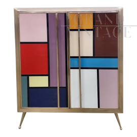 Two-door sideboard covered in colored glass squares  