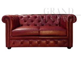 English red Chesterfield sofa