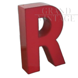 Vintage red plastic letter R from a 1970s sign   