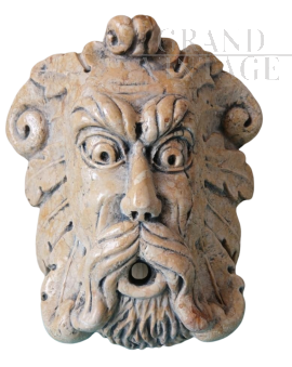 Antique style mask in royal yellow marble