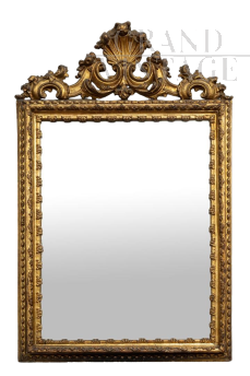 Antique Louis XVI Neapolitan mirror in gilded and carved wood