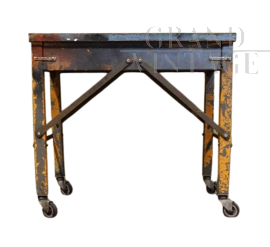 Industrial metal workshop table with wheels
