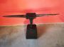 Antique double horn anvil with thin points, on a wooden block