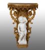 Antique console in gilded and carved wood with cherub sculpture                   
                            