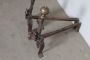 Antique pair of fireplace andirons in iron and brass from the 18th century