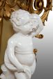 Antique console in gilded and carved wood with cherub sculpture