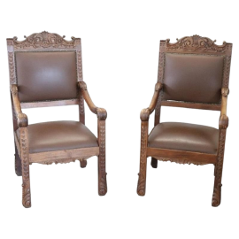 Pair of Renaissance style armchairs in carved walnut, late 19th century