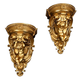 Pair of antique Louis Philippe shelves in carved and gilded wood      