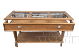 Vintage wooden shop counter with glass top              