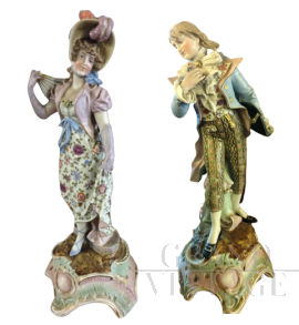 Pair of 19th century porcelain statues with characters 