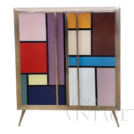Two-door sideboard covered in colored glass squares  