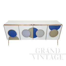 Illuminated sideboard in white glass with blue circles   