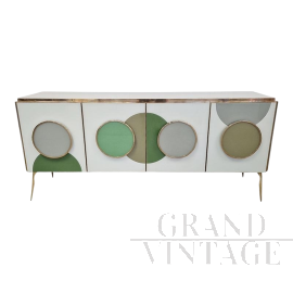 Illuminated sideboard in white glass with green circles     