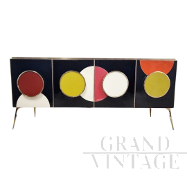 Backlit sideboard in black glass with colored circles   