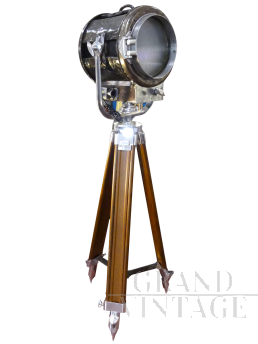 Vintage industrial spotlight with wooden tripod