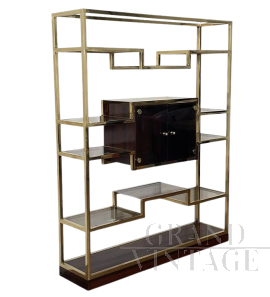 Design bookcase in brass and rosewood with central display case
