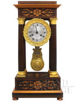 Antique Charles X pendulum clock in inlaid rosewood, 1800