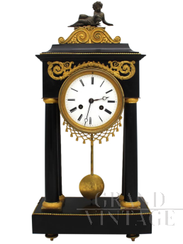 Antique pendulum clock from the Directoire period in gilded bronze and marble