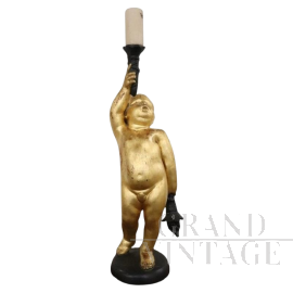 Antique style candle holder with gilded cherub