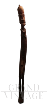 Sculpture with a long-limbed wooden figure, African art, 1970s