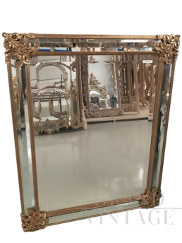 Mirror in gilded wood with flowers, antique style