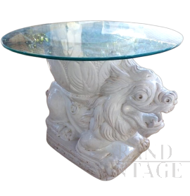 Vintage ethnic style coffee table with white ceramic lion base and glass top