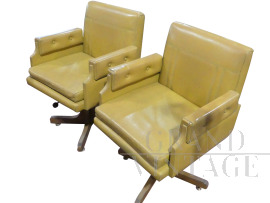 Pair of vintage swivel armchairs in ocher yellow skai