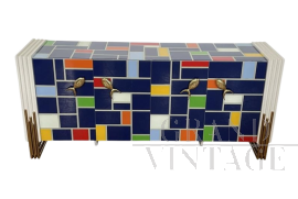 Multicolored glass sideboard with shaped golden handles