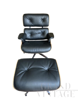 Lounge armchair by Charles Eames with pouf, in embossed black leather and rosewood