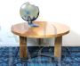 Mid-century round table in wood and steel with three legs           