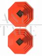 Pair of vintage tangerine orange plastic coat racks                            