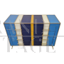 Dresser with 4 drawers covered in blue, white and yellow glass